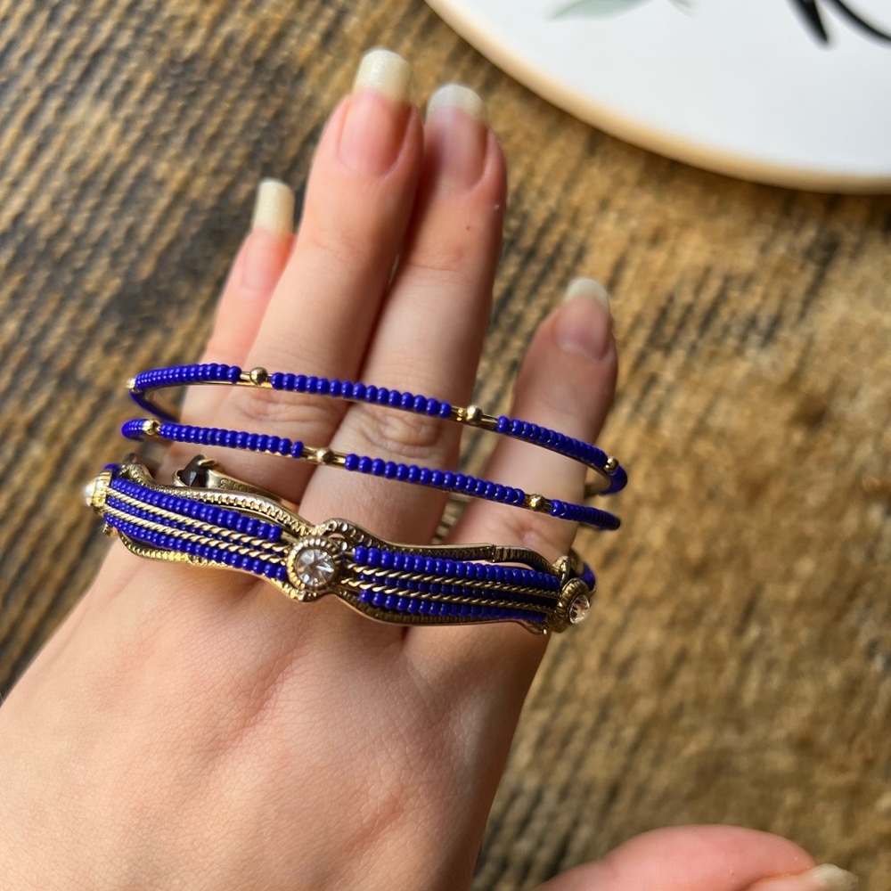 Beautiful set of 3 gold tone bracelets with blue beads